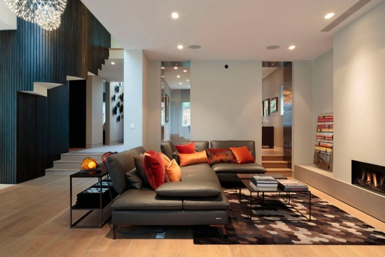 moderne-Wohnzimmer-Bilder-Ideen-Leder-Sofa-Teppich-weisse-Wand