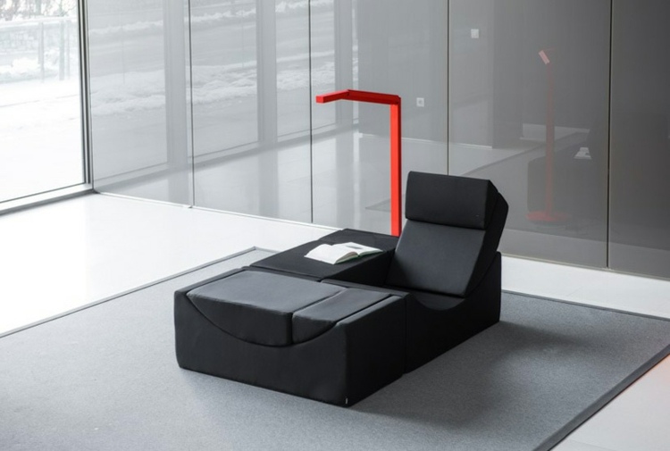 chaiselongue design schwarz buero einrichtung teppich lampe rot