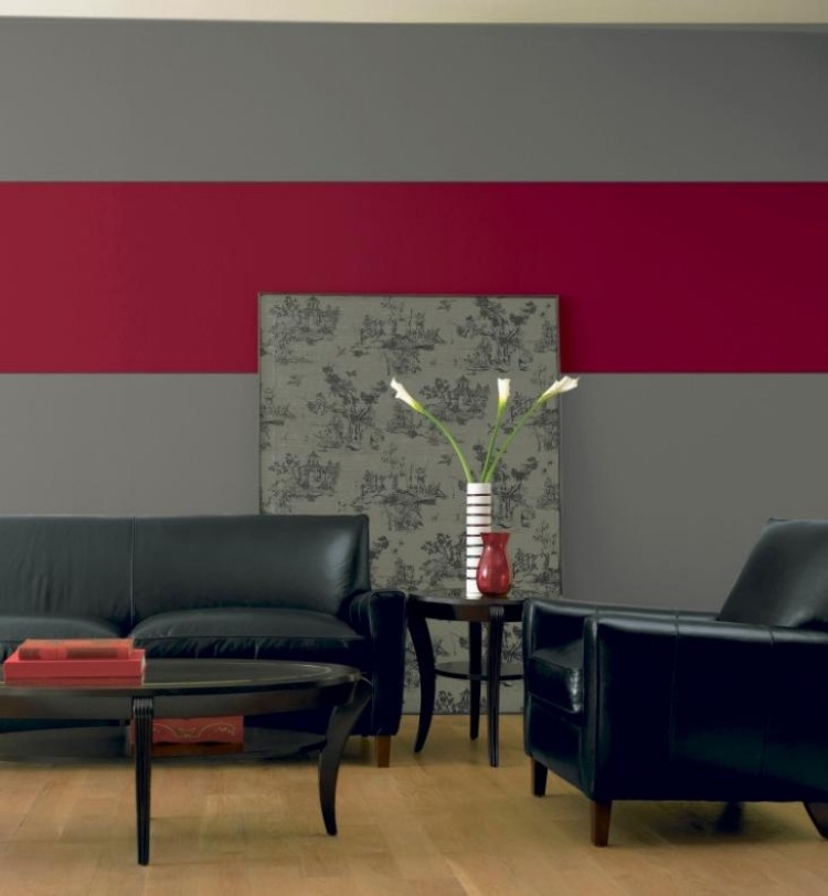 wandfarbe-grau-kombinationen-rot-schwarz-leder-couch-sessel-holzboden