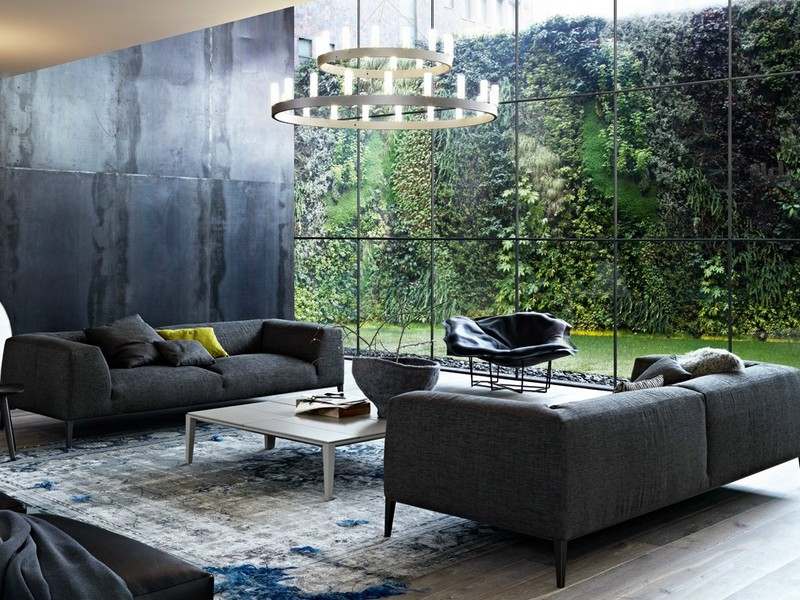 Sofa-Grau-Kilim-Wandgestaltung-Sichtbeton-Optik-Glaswand