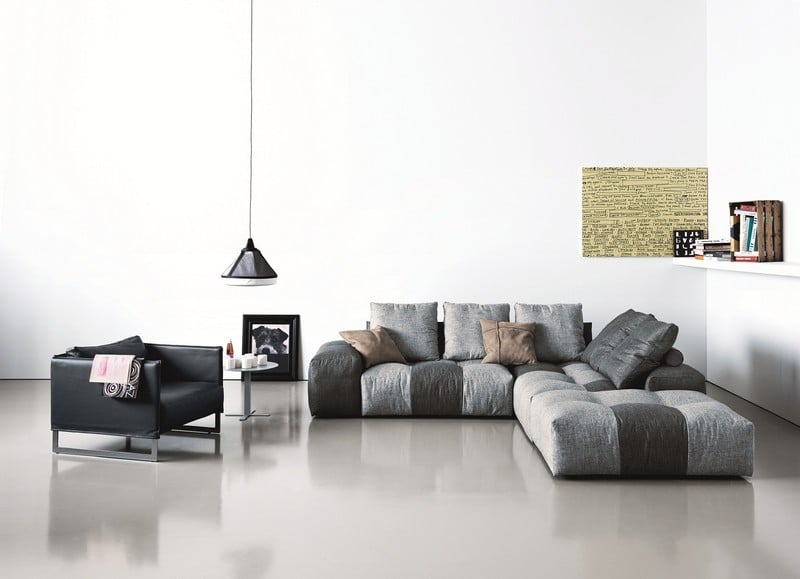Sofa-Grau-Pendelleuchte-Ledersessel-Wandkunst