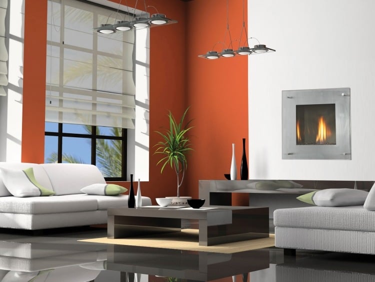 bioethanol-kamin-wandeinbau-modern-wohnzimmer-weiss-orange-pendeleluchten-couch-couchtisch