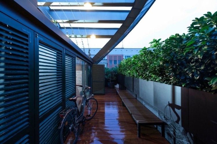loft beton klinker terrassen design modern ueberdachung holz fussboden sitzbank pflanzen