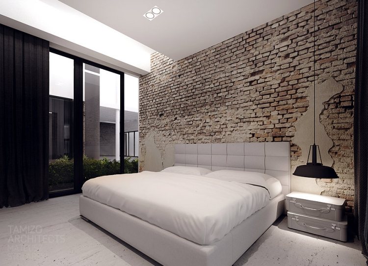 moderne Innenarchitektur -minimalistisch-schlafzimmer-backsteinwand-vorhaenge-schwarz-showroom-kler-tamizo