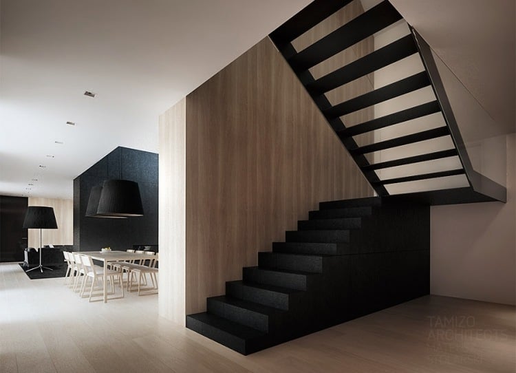 moderne-innenarchitektur-minimalistisch-treppe-schwarz-holzboden-wohnbereich-essrtisch-plock-tamizo