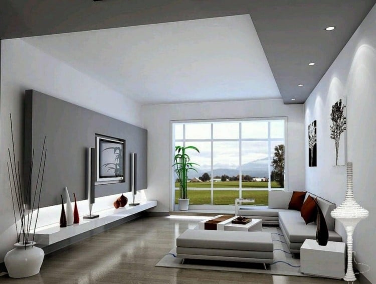 wohnzimmer-grau-eckcouch-terrassenfenster-modern-weiss-tvwand-deko-teppich-kissen