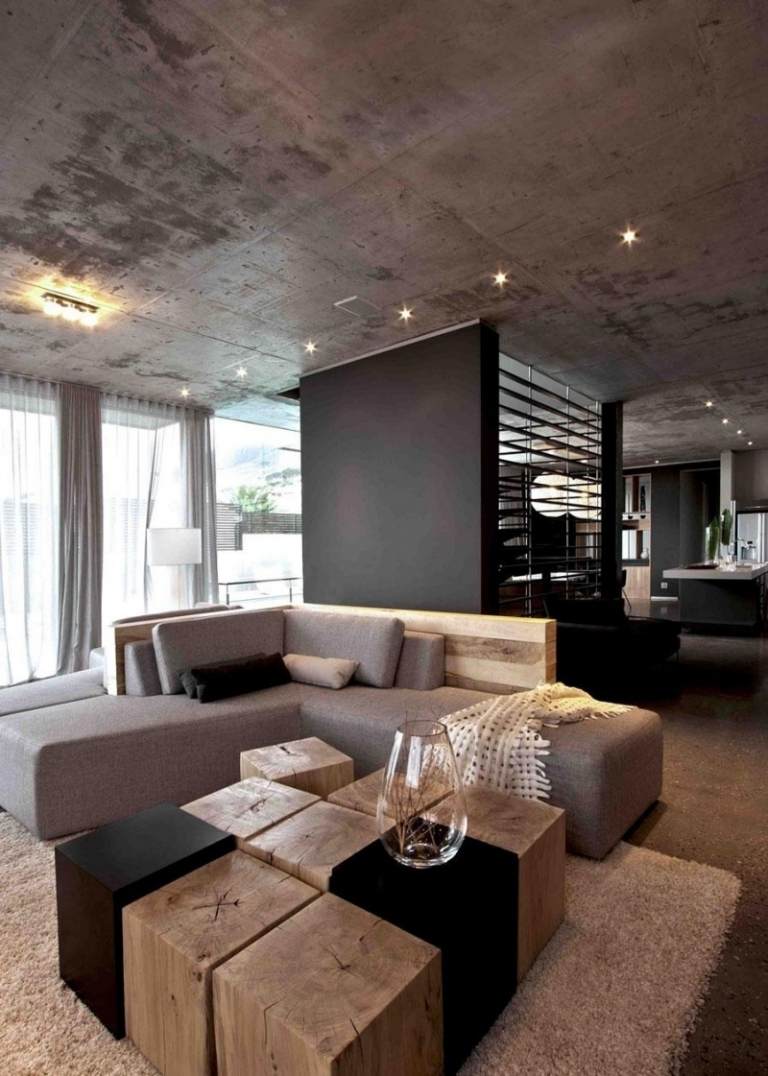 beton-design-modern-wohnzimmer-betondecke-eckcouch-braun-spots-holzelemente-couchtisch-holzbloecke