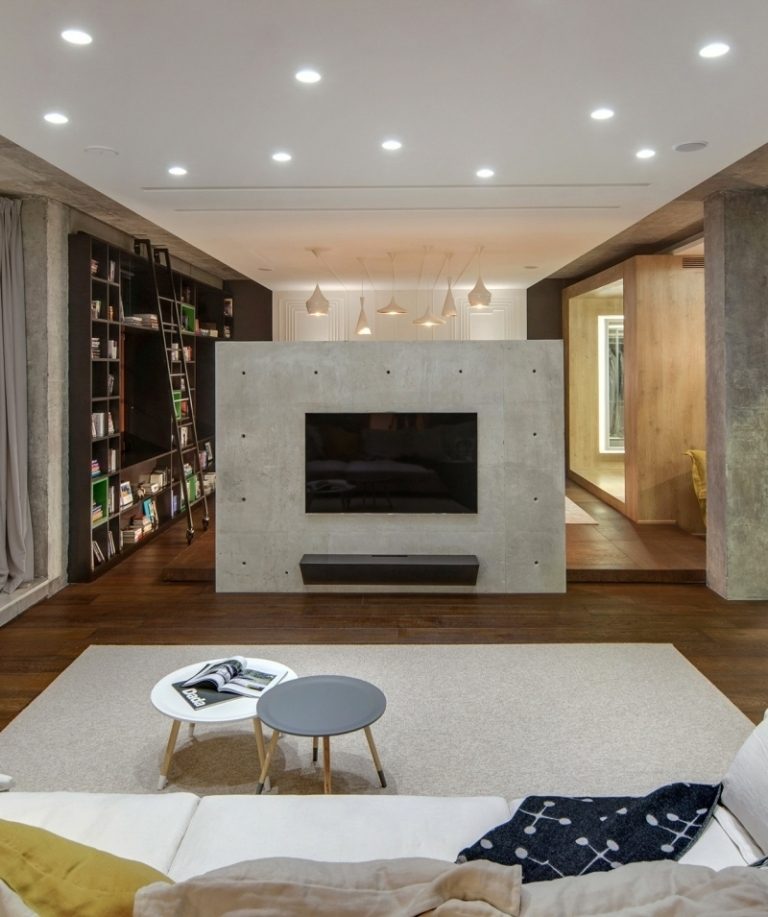 beton-design-modern-wohnzimmer-tvwand-couch-beistelltische-rund-fernseher-spots