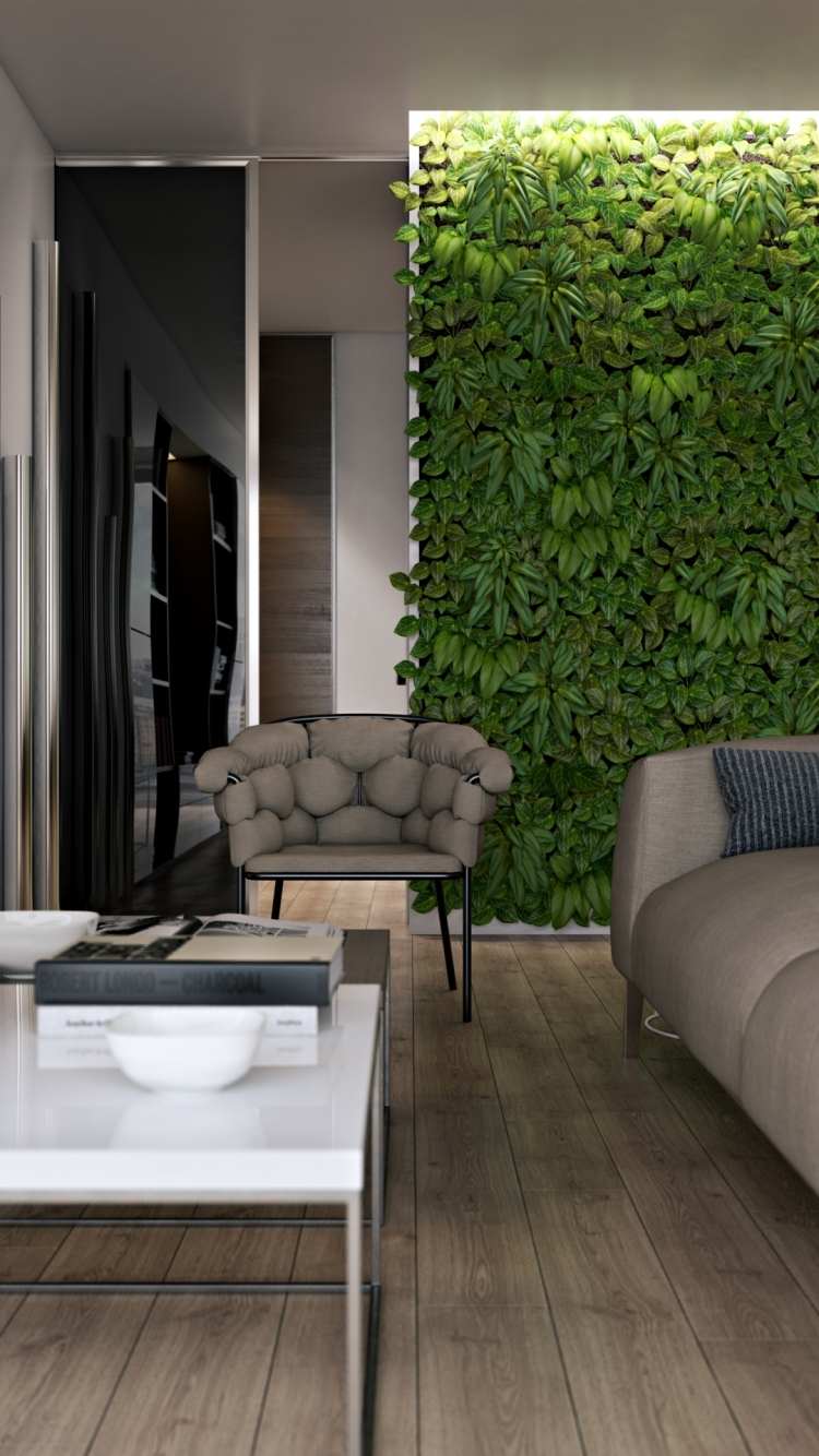 vertikaler-garten-wohnzimmer-bodenbelag-holzoptik-couch-couchtisch-beleuchtung-pflanzen-grau-sessel