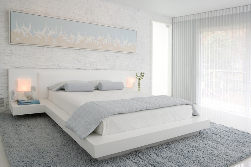 Schlafzimmer-Ideen-Weiss-Bett-Natursteinwand-modern