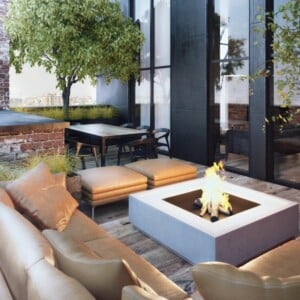 moderne klinker wandgestaltung terrasse couch leder beige feuerstelle