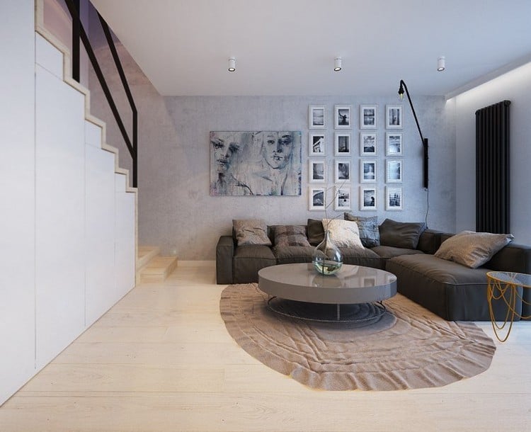 modernes Wohnzimmer ecksofa-grau-runder-couchtisch-hochglanz-heller-holzboden