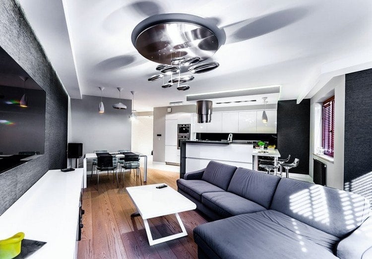 modernes-wohnzimmer-sofa-grau-holzboden-weisser-couchtisch