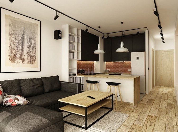 modernes Wohnzimmer sofa-schwarz-holzboden-wohnkueche-halbinsel