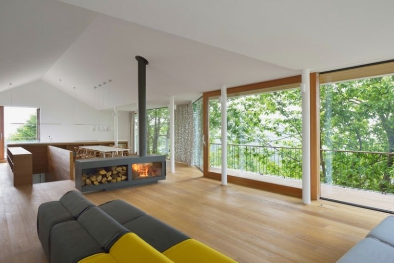 kaminofen design raumteiler feuerholz stauraum couch gelb grau