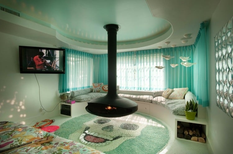 türkise vorhänge modern wohnzimmer idee rund couch kamin schwebeeffekt kieselstein