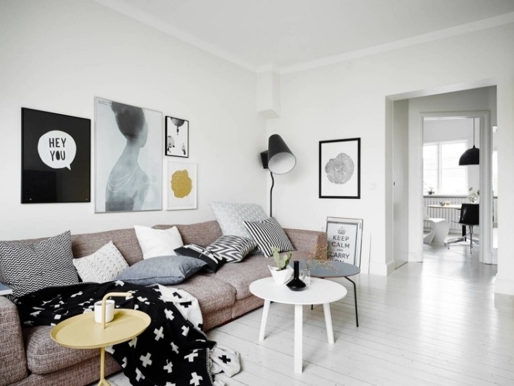 deko-wohnzimmer-skandinavisch-bilder-dielenboden-weiss-couch-beige-schwarz