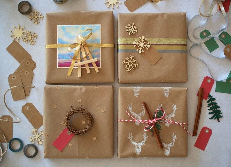 weihnachtsgeschenke-verpacken-ideen-kraftpapier-goldene-dekorationen-glitzer-baender