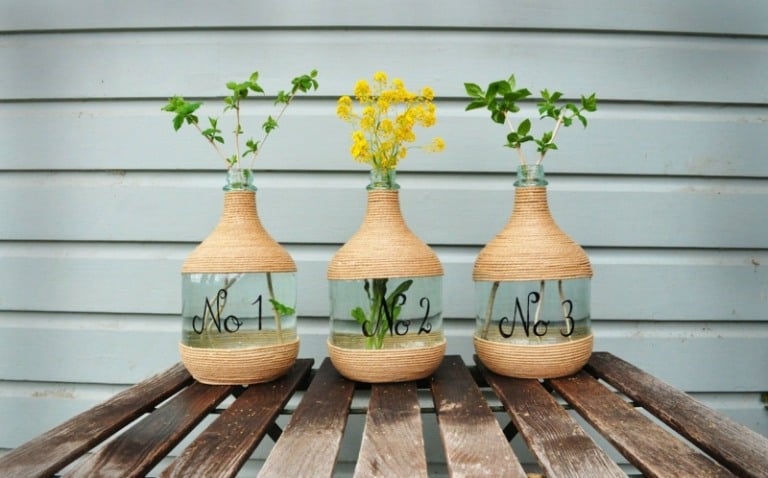 wohnideen kreative bastelidee vase flaschen garn kleben transparent mitte