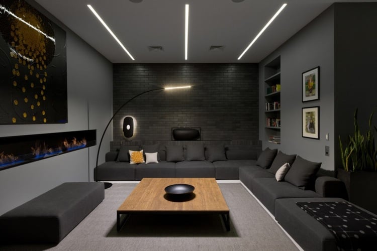 Anthrazit Farbe -modern-dachgeschosswohnung-wohnzimmer-couch-ecksofa-lampe-klinker