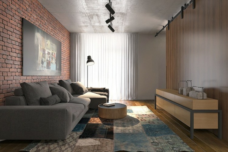 einraumwohnung-einrichten-backstein-wand-loft-stil-teppich-patchwork-grau-couch