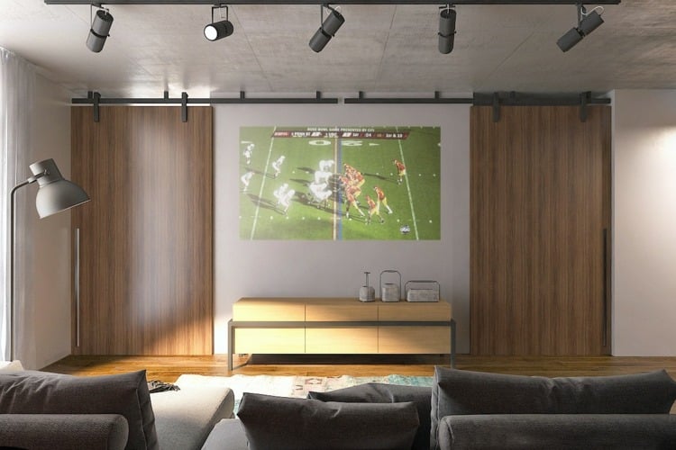 einraumwohnung-einrichten-beton-holz-projektor-scheinwerfer-lampen-stehlampe-wohnzimmer