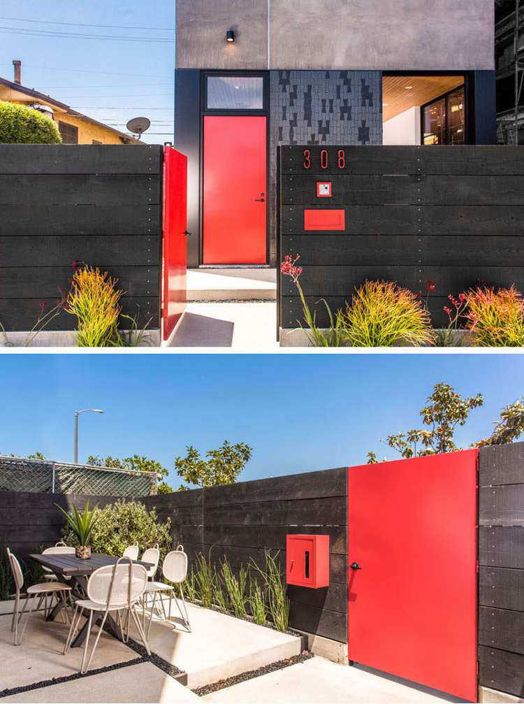 Fassade in Grau -zaun-schwarz-haustuer-gartentuer-rot