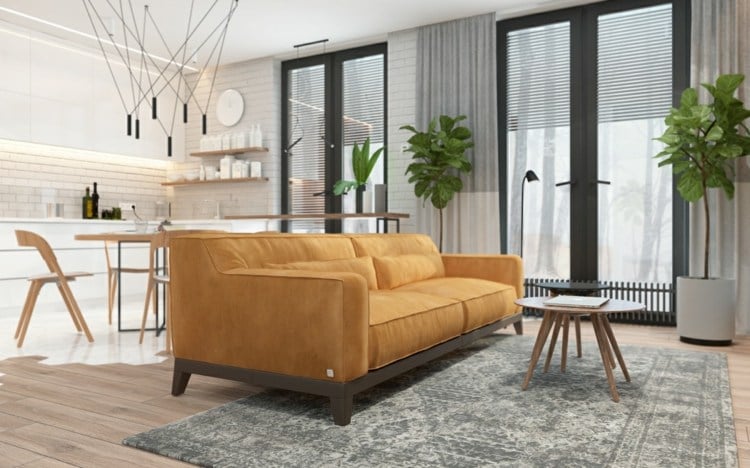 bett-wohnzimmer-integrieren-sofa-farbe-senf-grau-teppich-weis-kuche