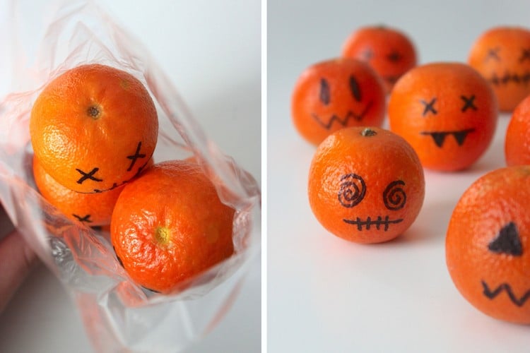 halloween-süßigkeiten-verpacken-lustig-clementinen-dekorieren-schwarzer-stift-schaurig