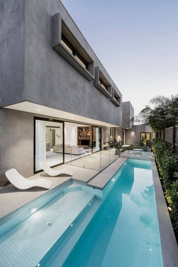 betonhaus-pool-minimalistische-fassade-auskragung-beleuchtung