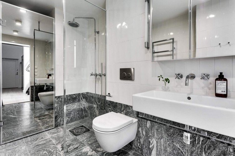 minimalistische-einzimmerwohnung-elegantes-bad-grau-weiß-begehbare-dusche