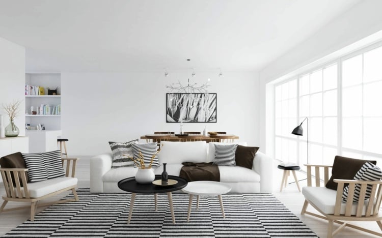 wohnzimmer skandinavisch-freundlich-ambiente-holz-naturmaterial-muster-textilien
