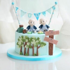 torte für zwillinge babyparty-jungen-girlande-blau-kuchen-bäume