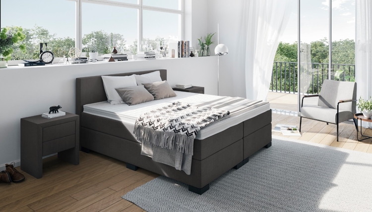 Boxspringbett-Anthrazit-gepolstert-schlafzimmer-weisse-wände-parkettboden