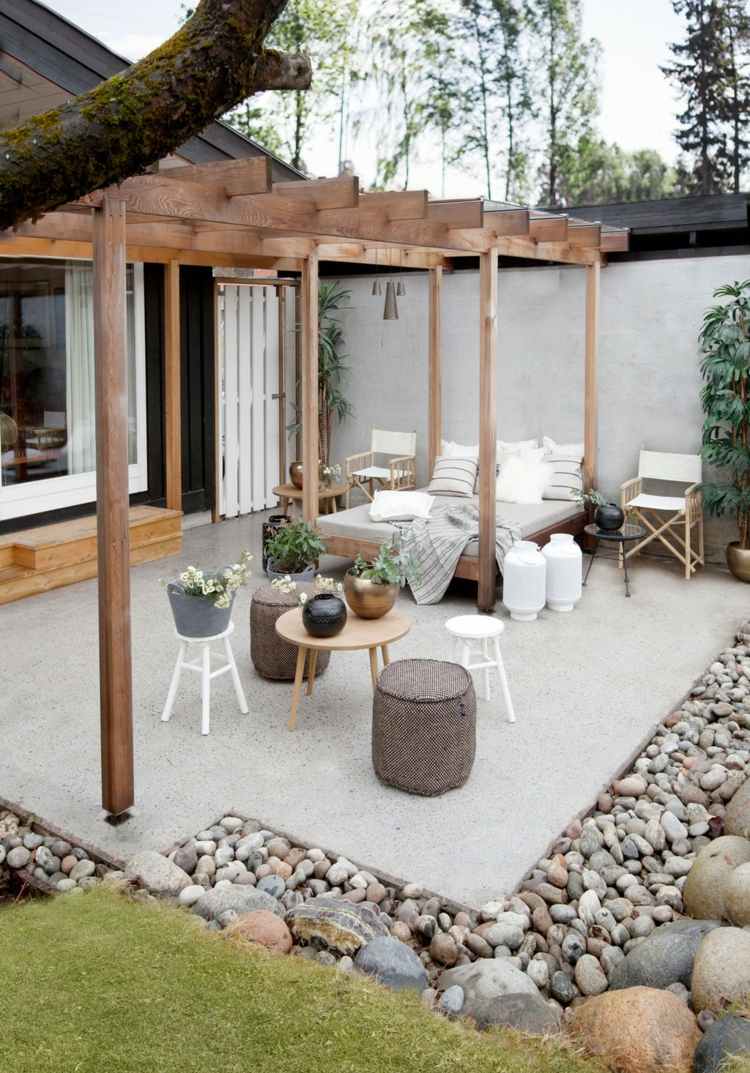 ideen-gartengestaltung-modern-terrassenabgrenzung-steine-pergola-tagesbett