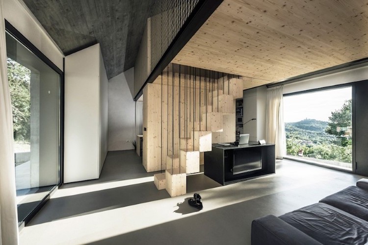 einraumhaus modern minimalistisch helles holz grau schwarz