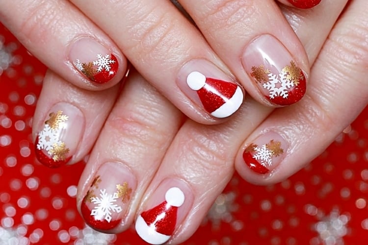 french nails für weihnachten rot weiß weihnachtsmannmütze goldene schneeflocken