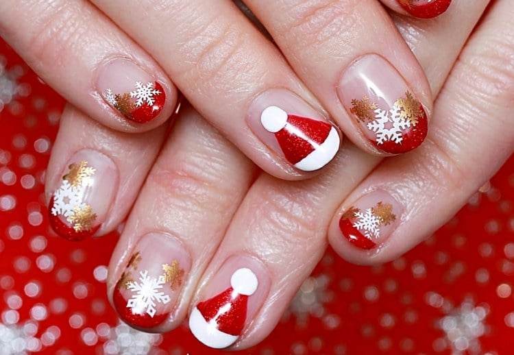 french nails für weihnachten rot weiß weihnachtsmannmütze goldene schneeflocken