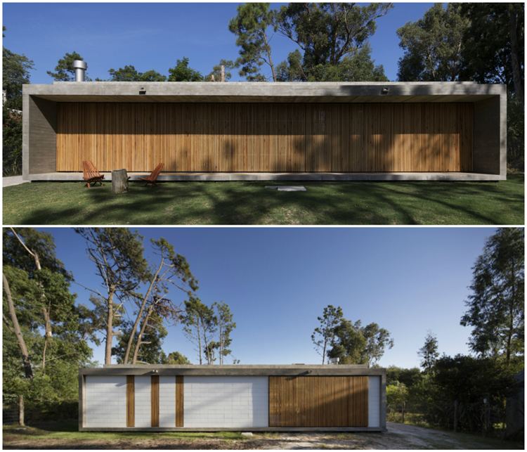 Klappläden aus Holz Fassadengestaltung Flachdachhaus Beton