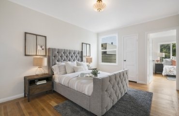 Schlafzimmer renovieren Polsterbett Kopfteil grau Teppich