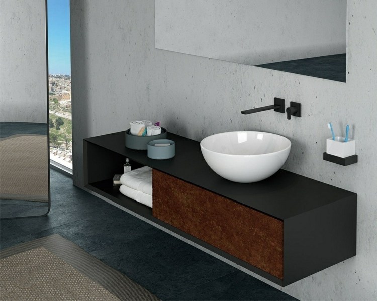 betonwand dunkles holz spiegel badezimmer armaturen schwarz minimalistisch