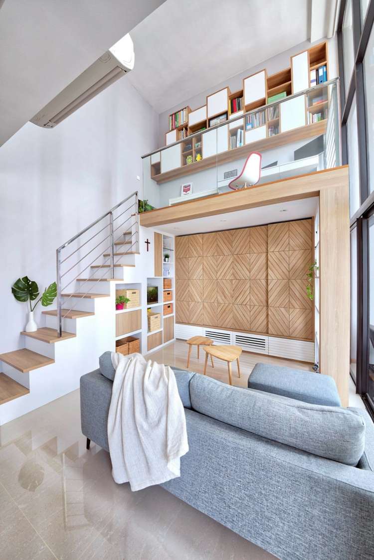 loft apartment modernes interieur sofa wand fischgrätmuster treppe