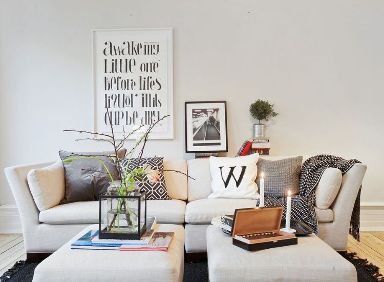 lagom design bedeutung wohnen wie in schweden lebensphilosophie minimalistisch leben wohndesign möbel couch wohnzimmer kerzen
