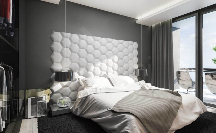 polsterwand im schlafzimmer wandpaneel bett rückenpolster wand rückenlehne polster design stoff gewebe pendelleuchte weiß modern geometrisch