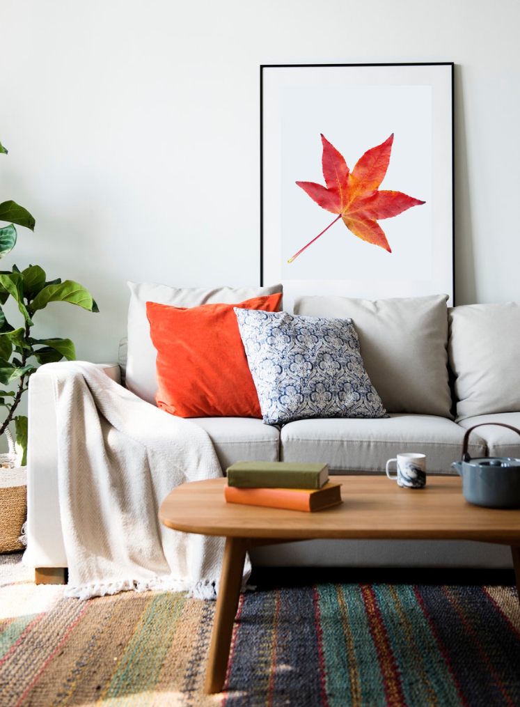 Herbstdekoration Wohnzimmer Orange Samtkissen Wandbild kuschelige Textilien