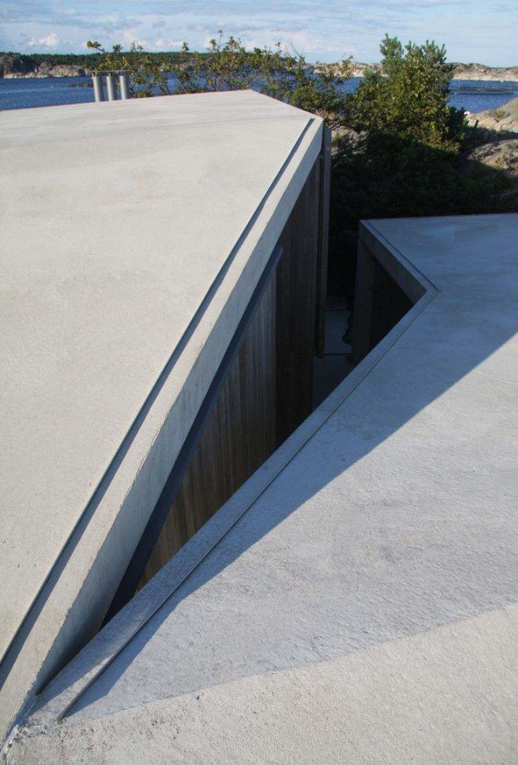 betondach weiß glatt ungerade formen holz ausblick meer