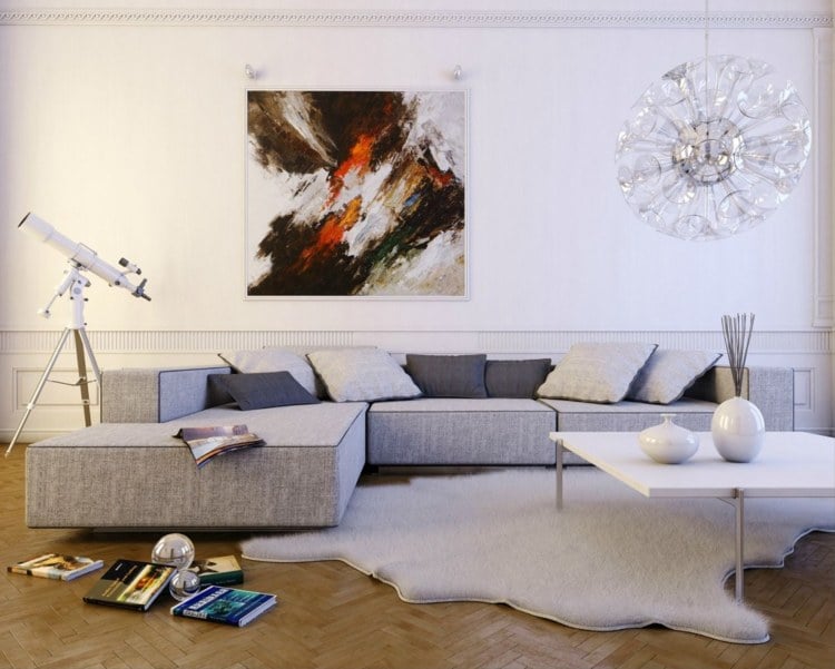 kleines wohnzimmer großes sofa grau teppich bilder wand