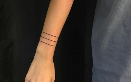 minimalistisches tattoo armband frau linien handgelenk unterarm