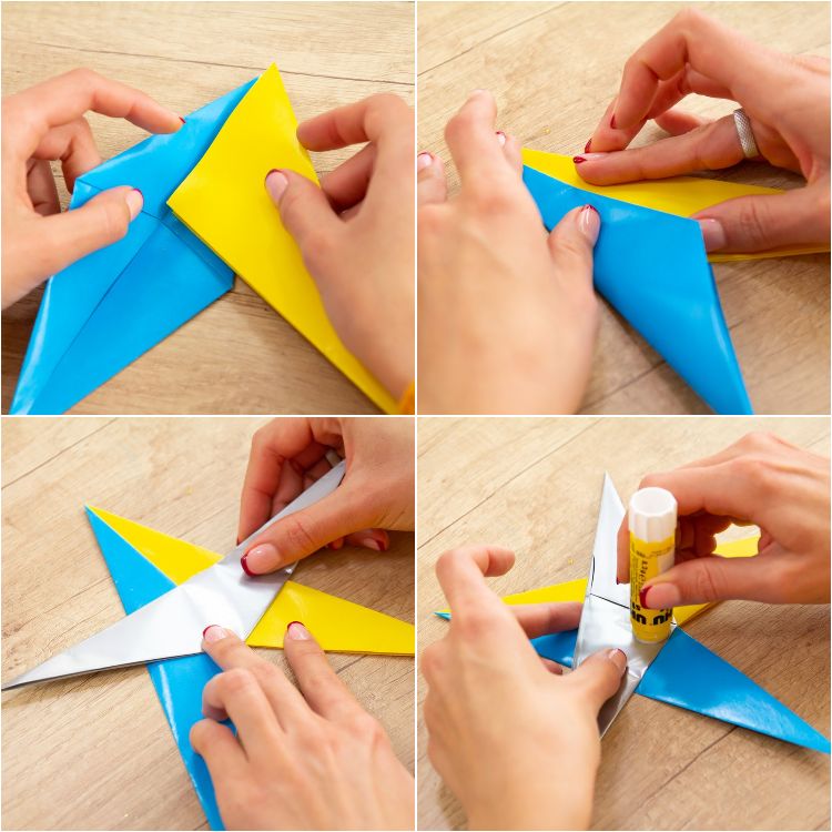 origami sterne wihnachtssterne selber basteln weihnachten falten einfach papierstücke blatt blau gelb uhu klebstoff letzte schritte