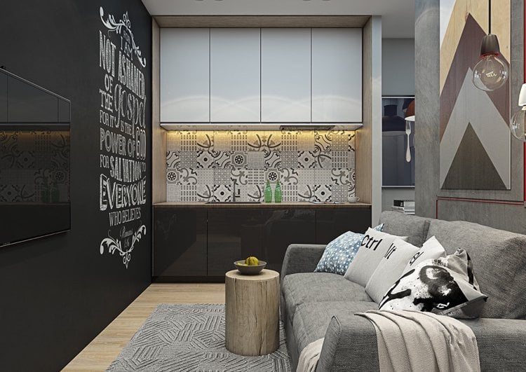 modernes Wohnzimmer mit Singleküche in Weiß und Schwarz graues Sofa
